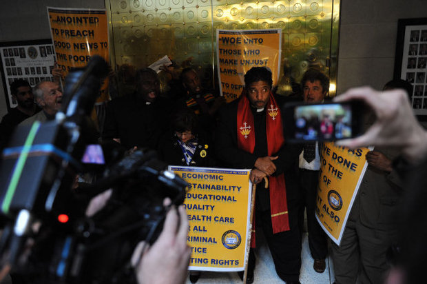 Opposing a Republican Legislature: NC NAACP President Dr. William Barber and 17 Others Protest and are Arrested at the NC General Assembly